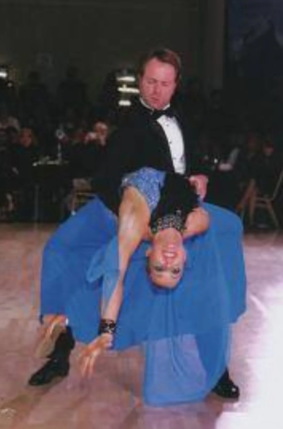 Mark Novak and his partner performing a dramatic dip during a ballroom competition